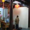 Inside temple with a worshiper.